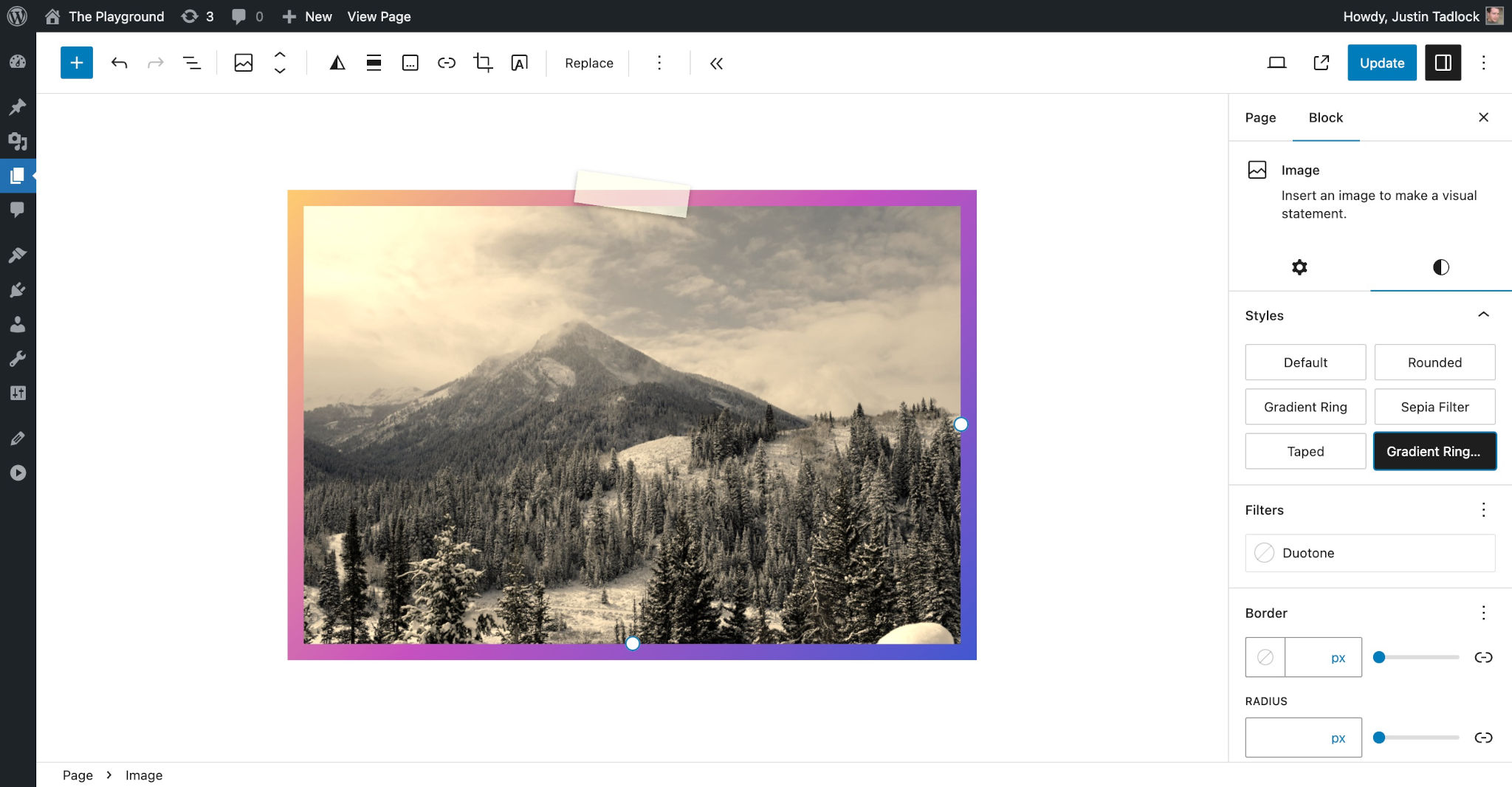 WordPress post editor with an image of mountains in the content canvas. The image has a piece of tape at the top, making it appear as if it were taped to a wall. The image has a brown tint to it.